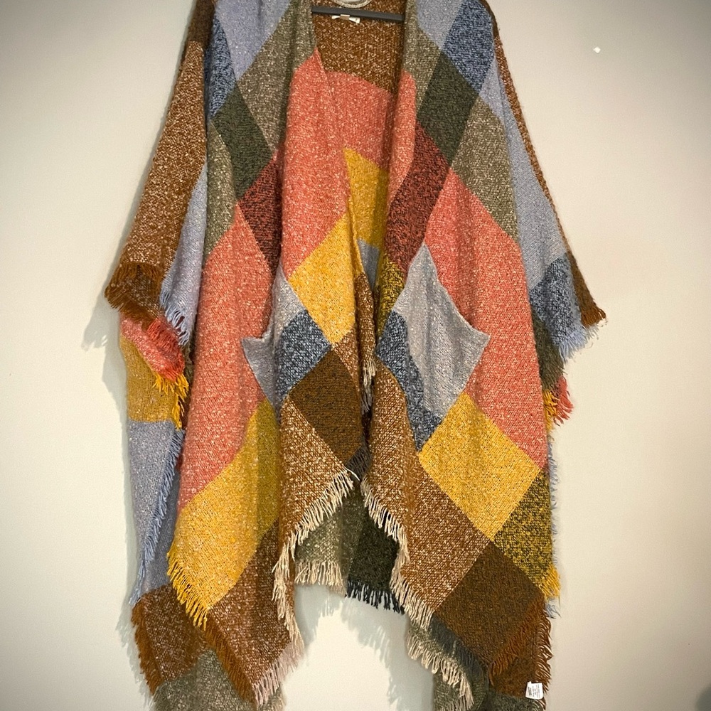 One size fits all World Market poncho. Super soft. Big hoodie, front pockets. .